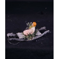 Antique Dresden cardboard, girl/wax on a sledge, size: 12 X 5 cm.