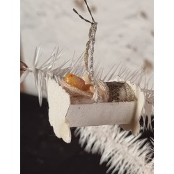 Antique cardboard ornament/Mica with wax doll in cradle, size: 4,5 x 3 cm.