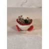 Snowchild in pine cone wagon, size: 8 x 5,5 cm.