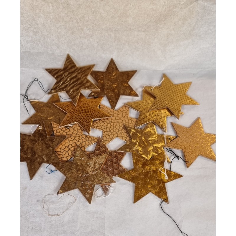 14 old golden foil stars, cardboard, h: 7 cm.