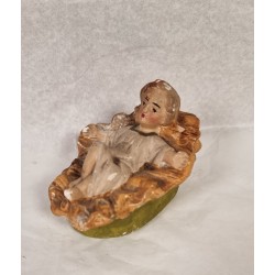 Old crib with Jesus child, size: 9 x 6,5 cm.