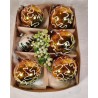 Box with old glass ornaments, golden/green ornaments with snow pattern, h: 6 cm.