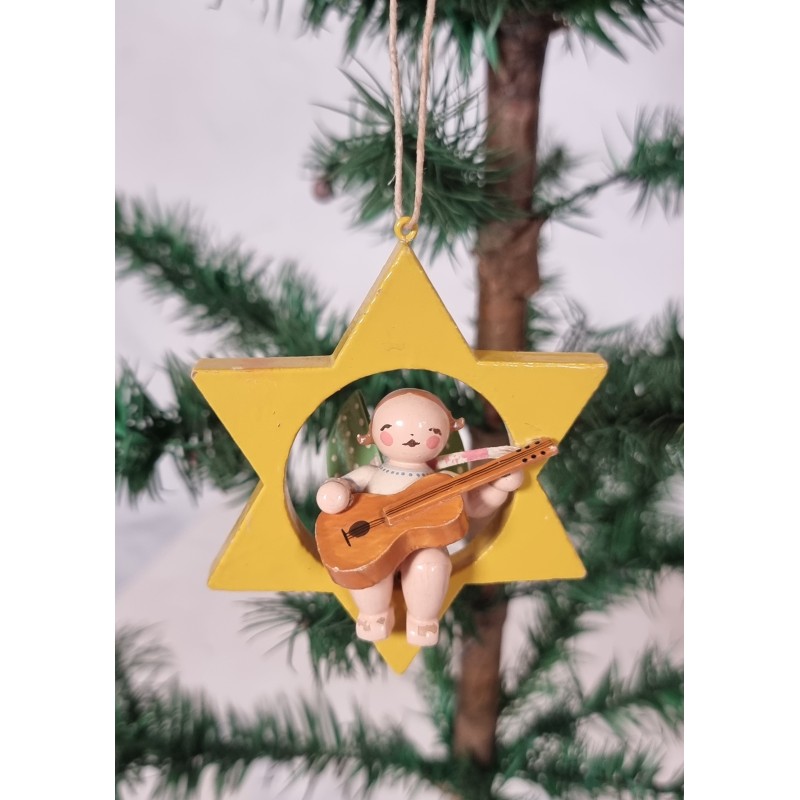 Tall Wendt und Kühn star with angel, h: 9 cm.