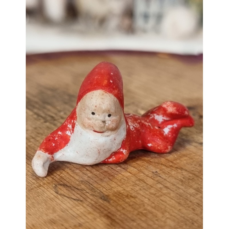 Antique bisquit elf, laying, h: 2,5 cm.