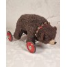 Old Steiff bear on wheel, size: 33 x 57 cm.