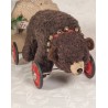Old Steiff bear on wheel, size: 33 x 57 cm.