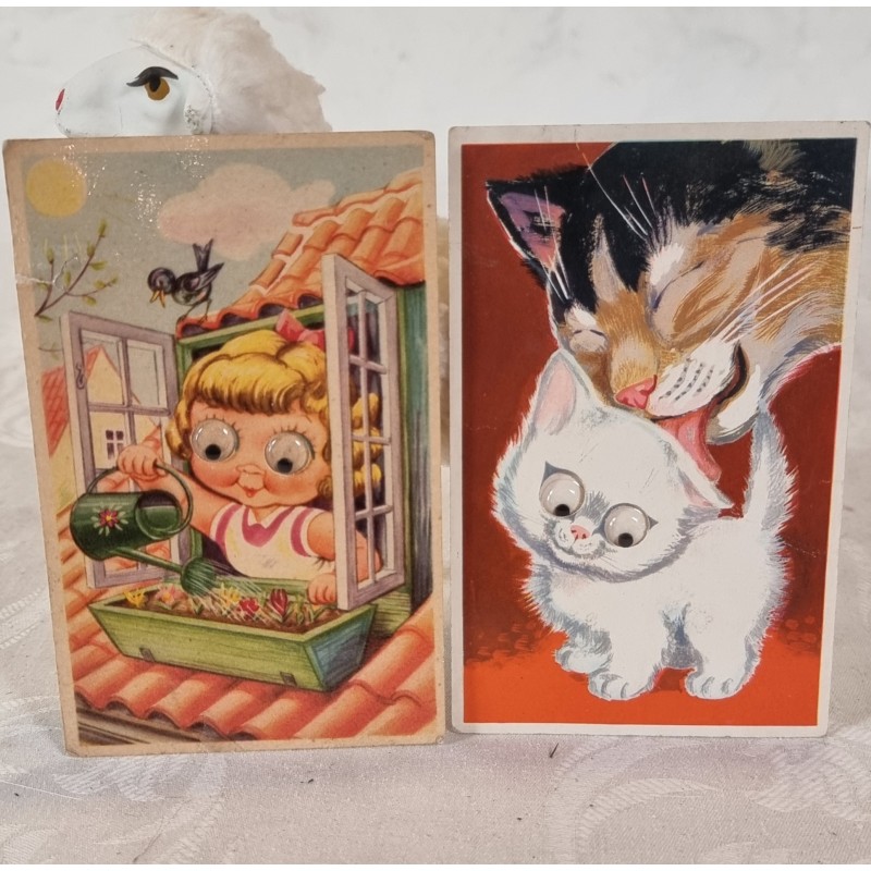 2 postcard from 1940 - 50, moving eyes, size: 14 x 9 cm.