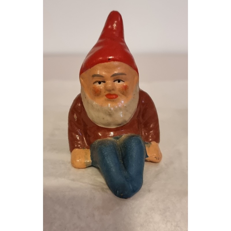 Old ceramic elf, sitting, h: 8,5 cm.
