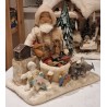 Display in cotton with Santa and Christmas presents and a music box, size: 26 cm (Santa)x 28 x 18 cm.