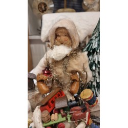 Display in cotton with Santa and Christmas presents and a music box, size: 26 cm (Santa)x 28 x 18 cm.