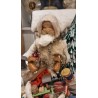 Display in cotton with Santa and Christmas presents and a music box, size: 26 cm (Santa)x 28 x 18 cm.