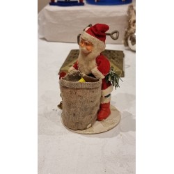Old Santa with papier-mache head and a filled sack, h: 15 cm.