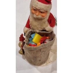 Old Santa with papier-mache head and a filled sack, h: 15 cm.