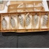 Box with tall old silver pinecones, h: 8 - 10 cm.
