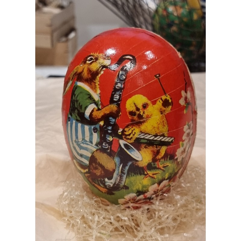 Antique cardboard Easter egg, bunny with a sax, h: 13 cm.