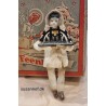 Cotton ornament, doll with antique bisquit head and Schwibbogen, h: 13 cm.