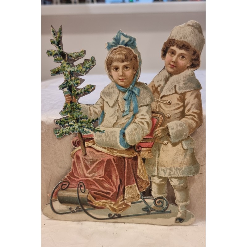 Antikt glansbillede/pap fra 1880, børn på kælk, h: 15 cm, b: 12,5 cm.