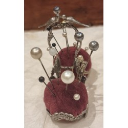 Antique pincushion with hatpins, size: 9 x 10 cm.