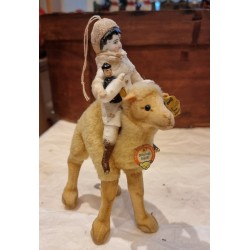 Old Steiff animal, dromedary + cotton doll with antique porcelain head, h: 20 cm.