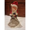 Old Santa with a sack, papier-mache head, h: 14 cm.