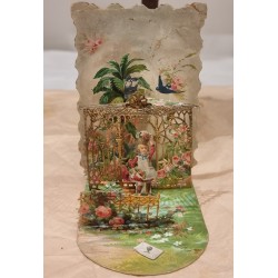 Antique 3 D card, child in garden with golden cage and more, h: 12 cm, l: 12 cm.
