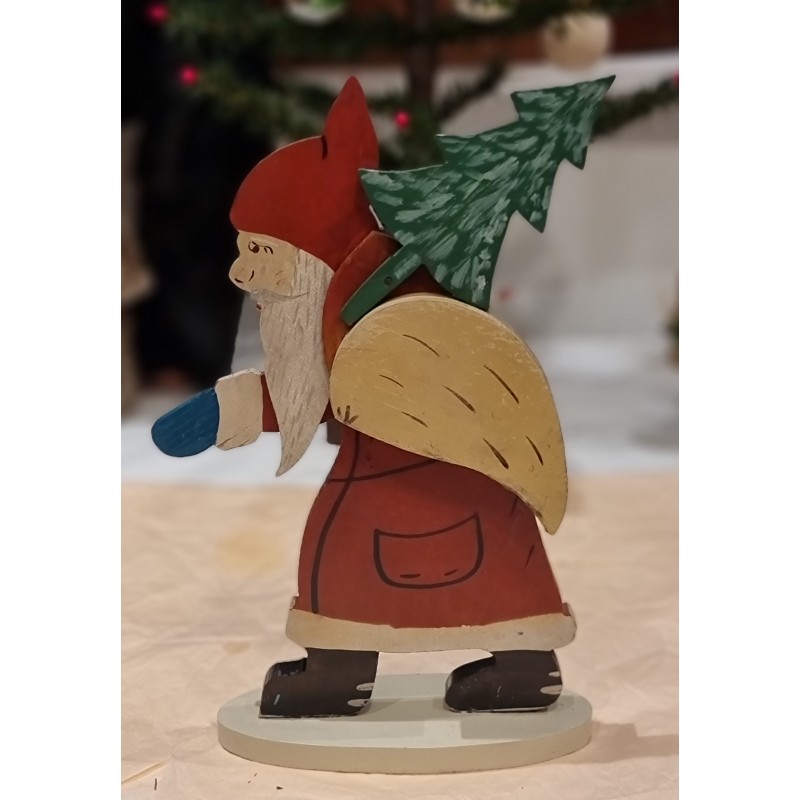 Old Santa in wood, with sack and tree , h: 26 cm.