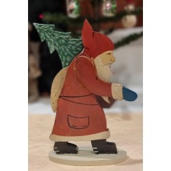 Old Santa in wood, with sack and tree , h: 26 cm.